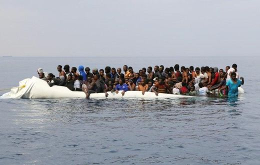 Migrants waiting to be rescued off the Libyan coast
