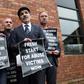 Alleged victims of historical institutional abuse pose outside the Crowne Plaza hotel in Belfast on January 20, 2017 as they arrive to attend the public statement on the publication of the Historical Institutional Abuse Inquiry Report
