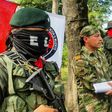 Colombian Soldier Fredy Moreno (C) who was kidnaped by National Liberation Army (ELN), shakes hands with a Red Cross member next to ELN guerrillas, before his release in Arauca, Colombia on February 6, 2017