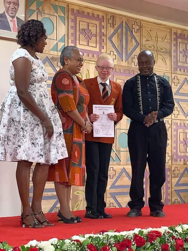 First Lady Margaret Kenyatta presenting Goldalyn Kakuya with the Brookhouse Scholarship