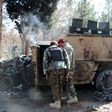 Afghan National Army (ANA) soldiers investigate a suicide car bomb attack in Lashkar Gah in Helmand Province on February 11, 2017