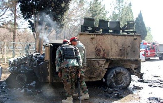 Afghan National Army (ANA) soldiers investigate a suicide car bomb attack in Lashkar Gah in Helmand Province on February 11, 2017