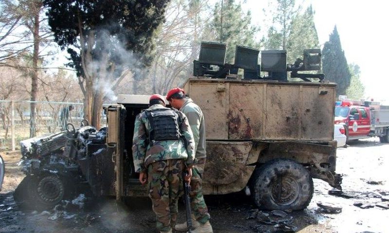 Afghan National Army (ANA) soldiers investigate a suicide car bomb attack in Lashkar Gah in Helmand Province on February 11, 2017