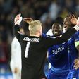 Leicester City's Danish goalkeeper Kasper Schmeichel (L) celebrates with teammates at the final whistle of their match match against Sevilla at the King Power Stadium on March 14, 2017