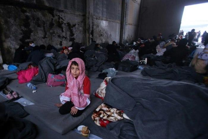 A Syrian boy, who fled with his family from rebel-held areas in the city of Aleppo, sits on November 30, 2016, inside a shelter in the neighbourhood of Jibrin, east of Aleppo