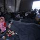 A Syrian boy, who fled with his family from rebel-held areas in the city of Aleppo, sits on November 30, 2016, inside a shelter in the neighbourhood of Jibrin, east of Aleppo