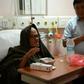 Taiwanese trekker Liang Sheng-yueh (L), who was rescued after being stranded in the Himalayas for 47 days, talks with a nutritionist in a hospital in Kathmandu on April 26, 2017