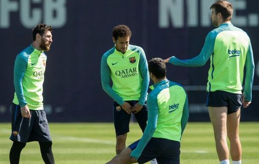Barcelona's Lionel Messi (L) chats with teammate Neymar (2ndL) and Gerard Pique (R) during a training session at the Sports Center FC Barcelona Joan Gamper in Sant Joan Despi, near Barcelona, on April 22, 2017