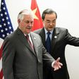 US Secretary of State Rex Tillerson (left) and China's Foreign Minister Wang Yi take their seats before a meeting at the World Conference Center in Bonn, western Germany, on February 17, 2017
