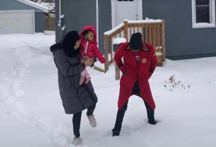 Jose Chameleone  and wife outside his house in US