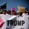 People hold sugns against US President Donald Trump during an anti-Trump march in Mexico City, on February 12, 2017