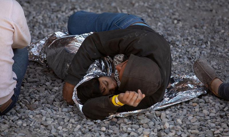 Migrants are Detained Under a Bridge in El Paso. What Happened?