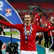 Manchester United's Zlatan Ibrahimovic celebrates with the trophy on the pitch after their victory in the English League Cup final match against Southampton at Wembley stadium in London on February 26, 2017