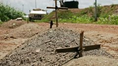 Makeshift graves are seen at the UN House for internally displaced persons in Juba on July 22, 2016