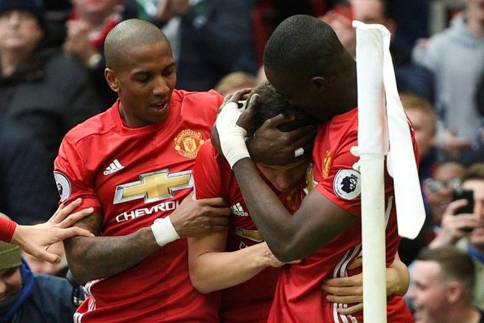 Manchester United's Ashley Young (L) is a former England international and has made just 13 starts for his club this season