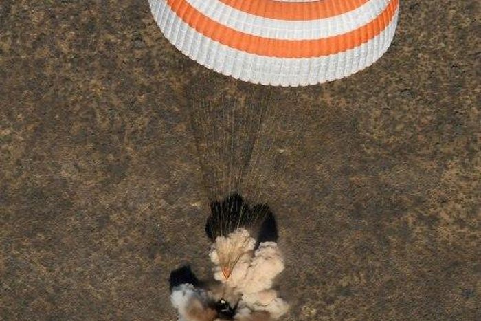 A Soyuz MS-02 capsule brings Russian cosmonauts Sergey Ryzhikov and Andrey Borisenko and US astronaut Shane Kimbrough back home after a 173-day mission to the International Space Station