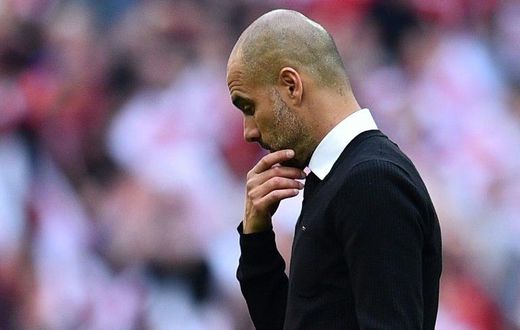 Manchester City's manager Pep Guardiola suffers defeat after the FA Cup semi-final football match against Arsenal at Wembley stadium in London on April 23, 2017