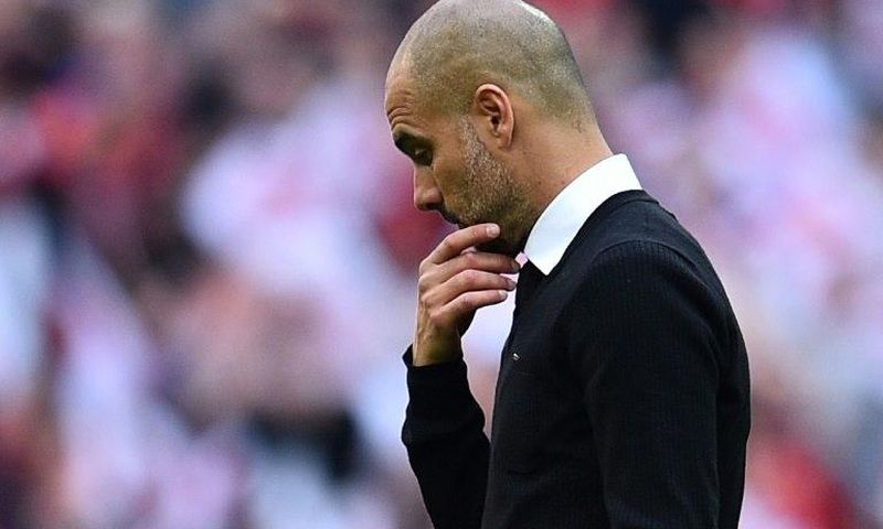 Manchester City's manager Pep Guardiola suffers defeat after the FA Cup semi-final football match against Arsenal at Wembley stadium in London on April 23, 2017