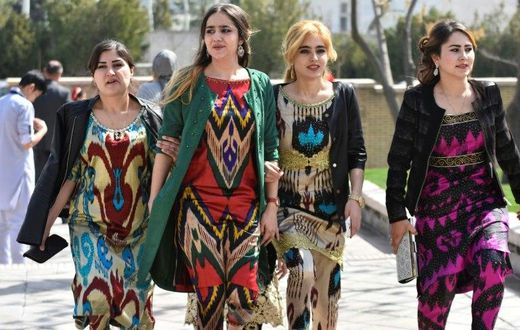 A growing number of Tajik women have been following a government recommendation to wear the Atlas and other traditional forms of dress