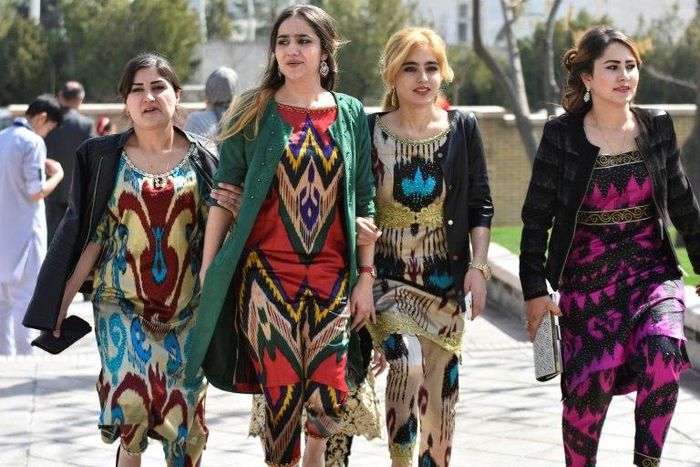 A growing number of Tajik women have been following a government recommendation to wear the Atlas and other traditional forms of dress