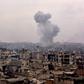 Smoke rises from buildings in Aleppo's eastern Karm al-Jabal neighbourhood on December 5, 2016