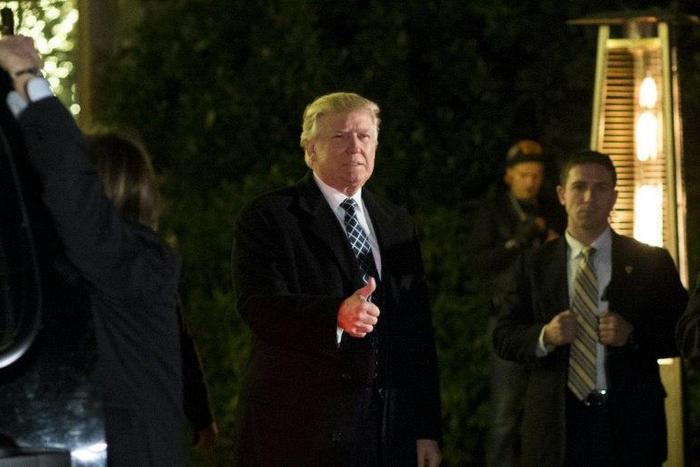 US President-elect Donald Trump arrives to attend a ?Villains and Heroes? themed costume party on December 3, 2016
