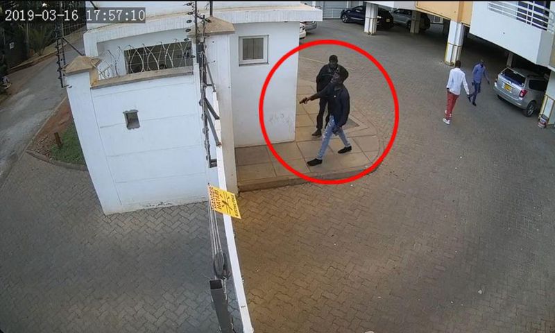 Man hunt for foreigner captured on video threatening to shoot security guard