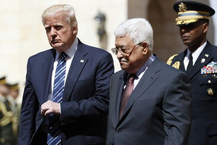 US President Donald Trump (L) is welcomed by Palestinian leader Mahmud Abbas at the presidential palace in the West Bank city of Bethlehem on May 23, 2017