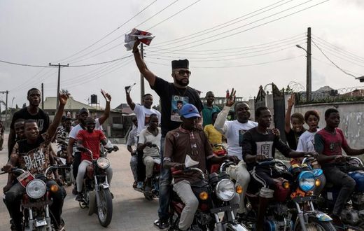 US-Nigerian musician Olubankole Wellington, popularly known as Banky W., rode with supporters in a line of motorcycles during a campaign rally in Lagos