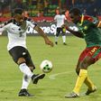 Ghana's forward Jordan Ayew (L) challenges Cameroon's defender Michael Ngadeu-Ngadjui during the 2017 Africa Cup of Nations semi-final football match between Cameroon and Ghana in Franceville on February 2, 2017
