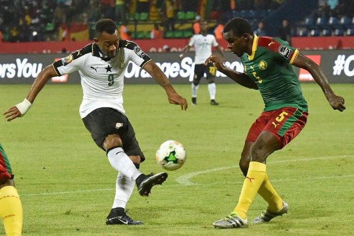 Ghana's forward Jordan Ayew (L) challenges Cameroon's defender Michael Ngadeu-Ngadjui during the 2017 Africa Cup of Nations semi-final football match between Cameroon and Ghana in Franceville on February 2, 2017