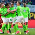 Wolfsburg's Brazilian midfielder Luiz Gustavo (C) and his teammates react after receiving the yellow and the red card during the German first division Bundesliga football match between VfL Wolfsburg and Bayern Munich on April 29, 2017