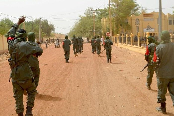 Malian army soldiers, pro-government militia members and former rebels, predominantly Tuaregs, take part in a joint patrol in Gao in northern Mali in February 2017