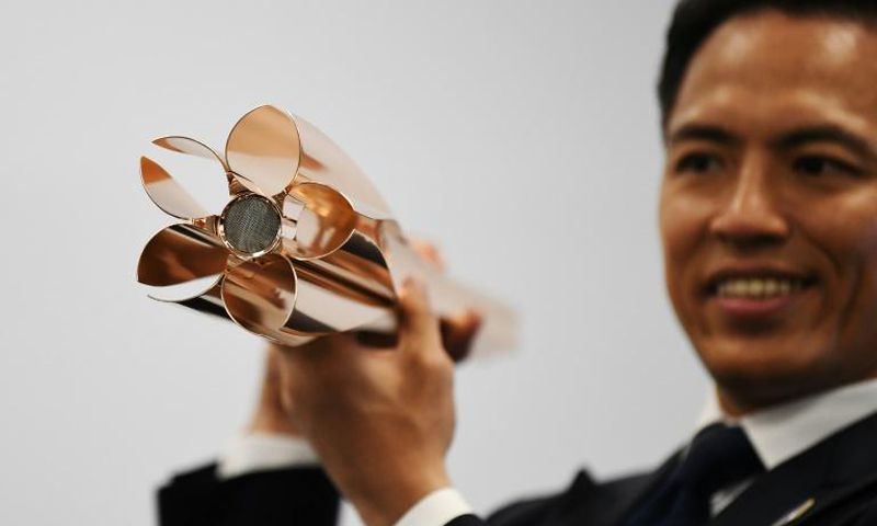 The top part of the Olympic torch is shaped in the traditional emblem of the sakura, or cherry blossom