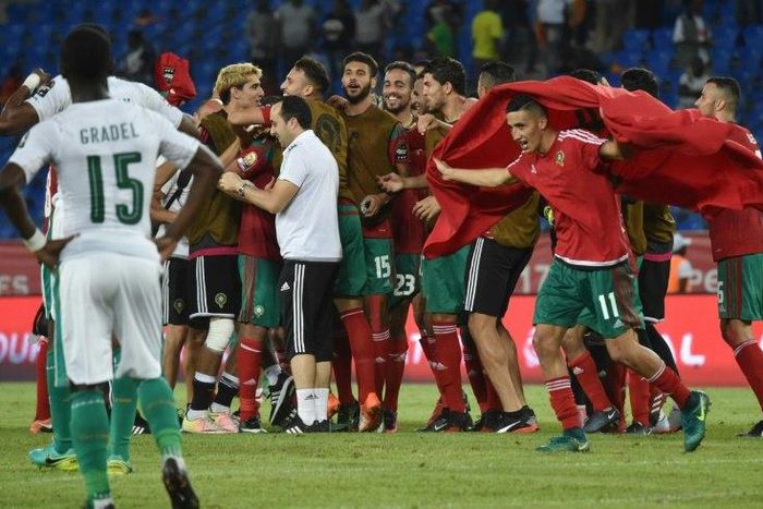 Ivory Coast players watch as Moroccan players celebrate at the end of their 2017 Africa Cup of Nations match on January 24, 2017