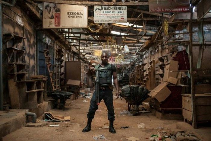 A security guard stands in the empty Ogbaru Market as shops and businesses shut down to mark the anniversary of the Biafra independence declaration