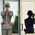 A North Korean soldier looks at the South side at the truce village of Panmunjom in the Demilitarized zone (DMZ) dividing the two Koreas on July 27, 2013