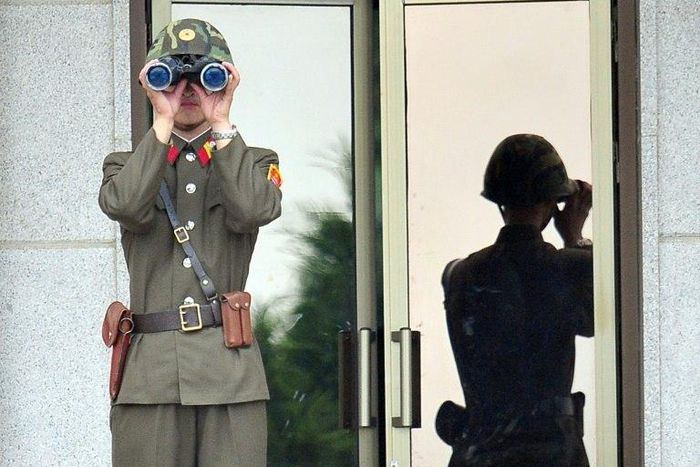 A North Korean soldier looks at the South side at the truce village of Panmunjom in the Demilitarized zone (DMZ) dividing the two Koreas on July 27, 2013