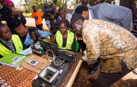 Raila Odinga (right) during an inspection of the Mass Voter Registration (MVR) exercise at Lavington Primary School.