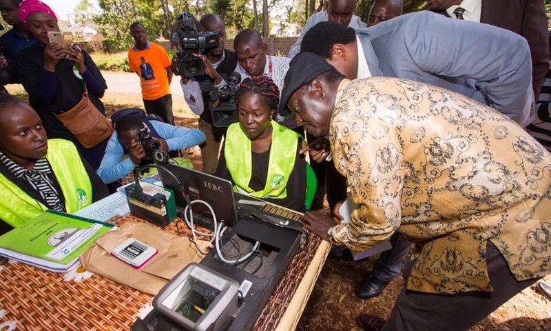 Raila Odinga (right) during an inspection of the Mass Voter Registration (MVR) exercise at Lavington Primary School.