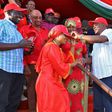 President Uhuru Kenyatta receives defectors during a public rally at Voi Stadium. Looking on is Dr Naomi Shaban.