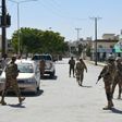 Pakistani soldiers stand guard at the site where a Chinese couple was kidnapped in the neighbourhood of Jinnah town in Quetta on May 24, 2017