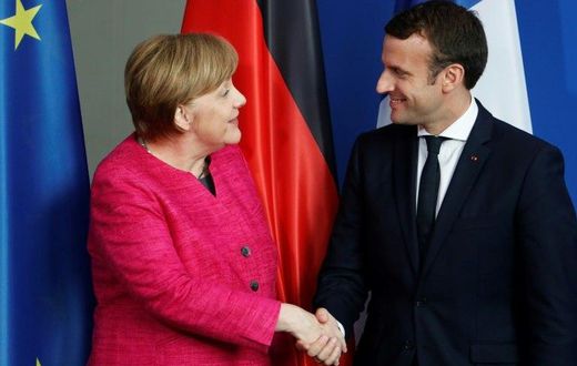 German Chancellor Angela Merkel (L) and French President Emmanuel Macron in Berlin on May 15, 2017