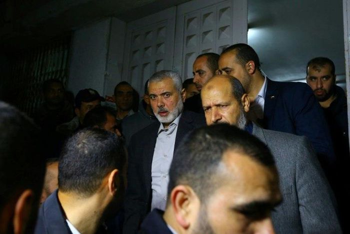 Senior Hamas leader Ismail Haniya (C) leaves a hospital morgue in Gaza City on March 24, 2017 after gunmen in the Gaza Strip shot dead a Hamas official who was freed by Israel in a 2011 prisoner swap