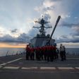 The USS Dewey has sailed in disputed South China Sea waters near a reef claimed by Beijing