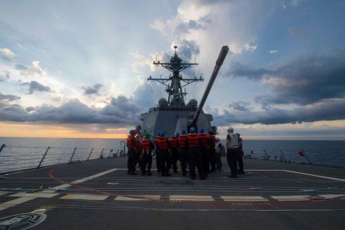 The USS Dewey has sailed in disputed South China Sea waters near a reef claimed by Beijing