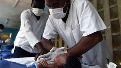 Medics treating a child at a hospital