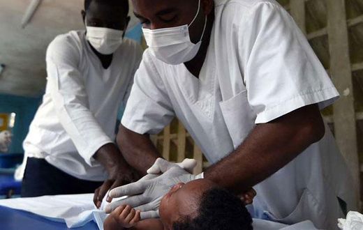 Medics treating a child at a hospital
