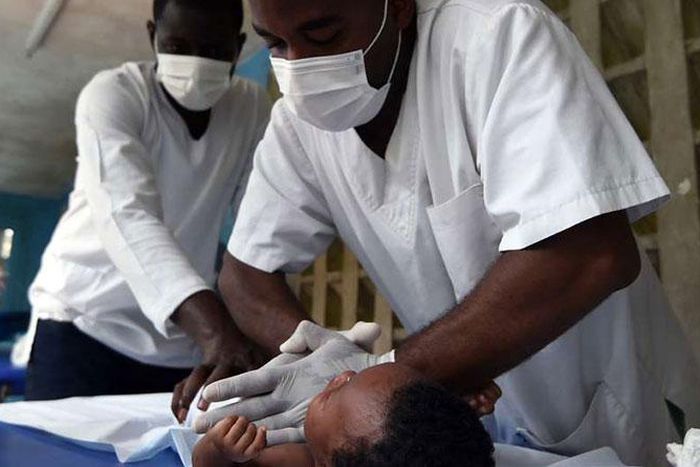 Medics treating a child at a hospital