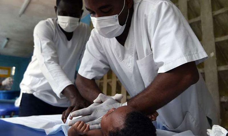 Medics treating a child at a hospital